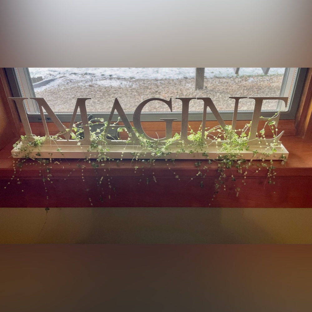 IMAGINE sign